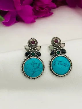 Stunning Turquoise Blue Stone Studded Leaf Designed Round Shaped Silver Toned Oxidized Stud Earrings